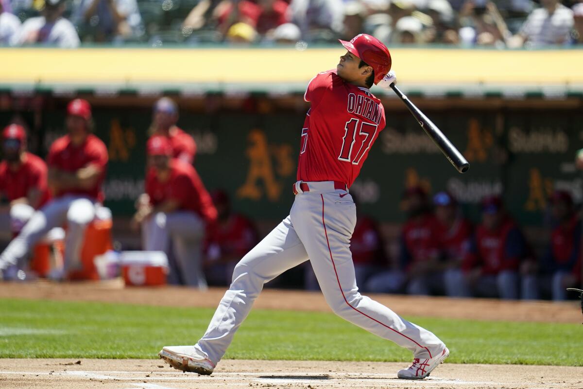 Angels designated hitter Shohei Ohtani watches his two-run home run.