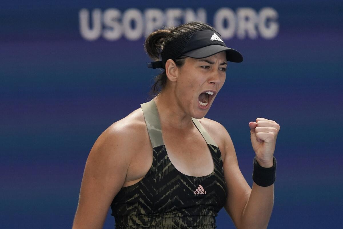 Garbine Muguruza pumps her fist after scoring a point against Victoria Azarenka on Friday at the U.S. Open.