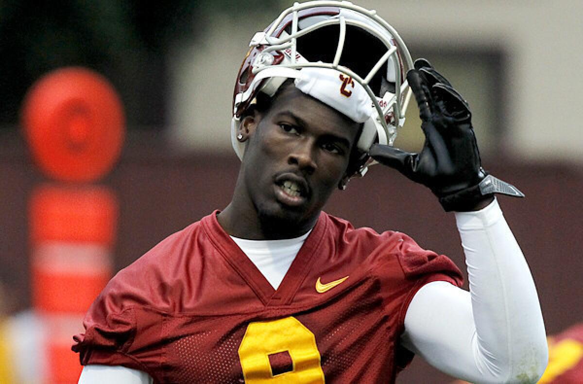 USC receiver Marqise Lee takes off his helmet during a break in spring practice.