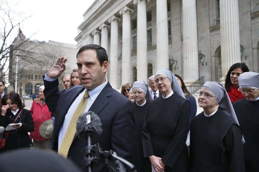 Attorney Mark Rienzi, who represented the Little Sisters of the Poor, talks to reporters last year in Denver.