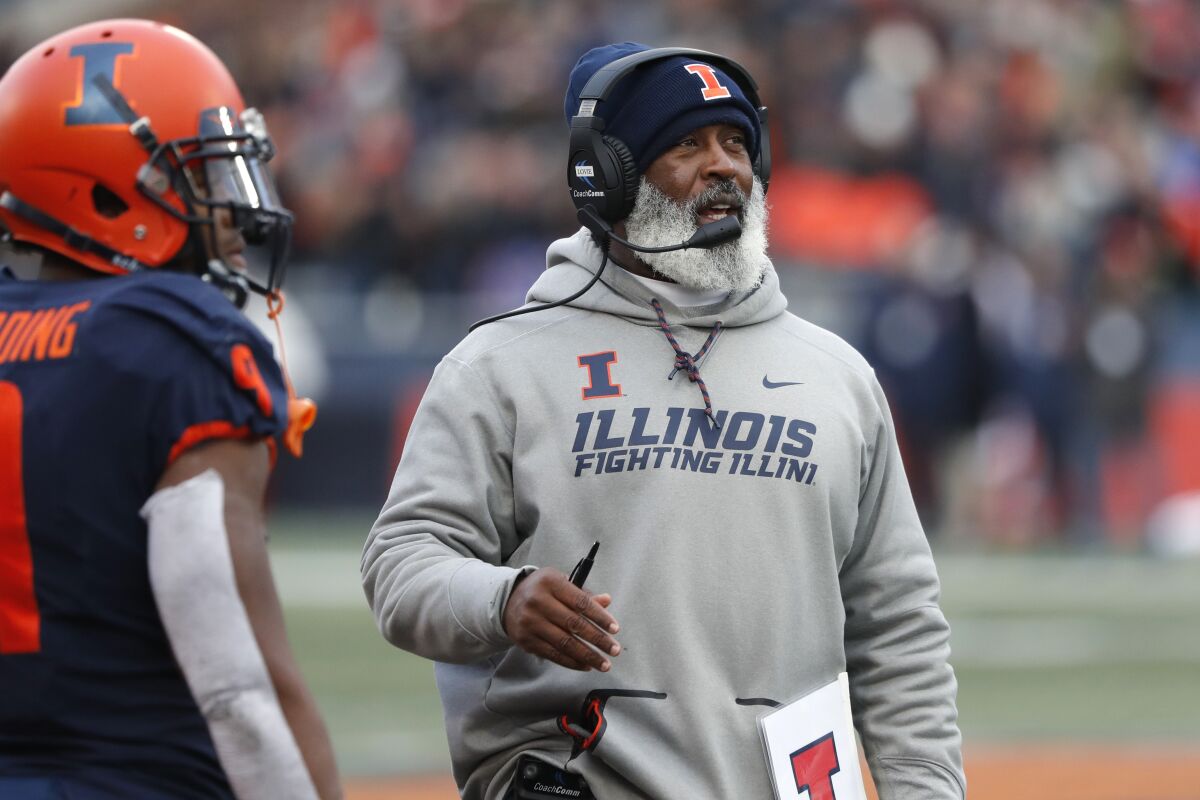 Illinois coach Lovie Smith looks up at the scoreboard