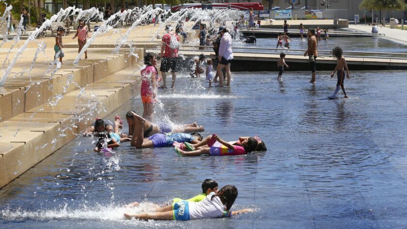 Children helped beat Monday's heat with a trip to the County Administration Center Waterfront Park.