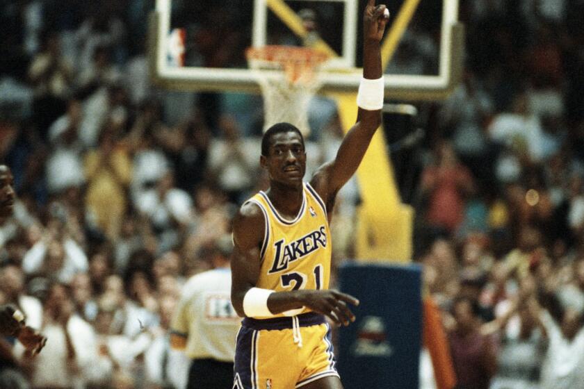 Laker forward Michael Cooper raises his finger to signify the Lakers are #1 at the end of the game 6/4. Cooper threw in 6 three point baskets in 7 tries.