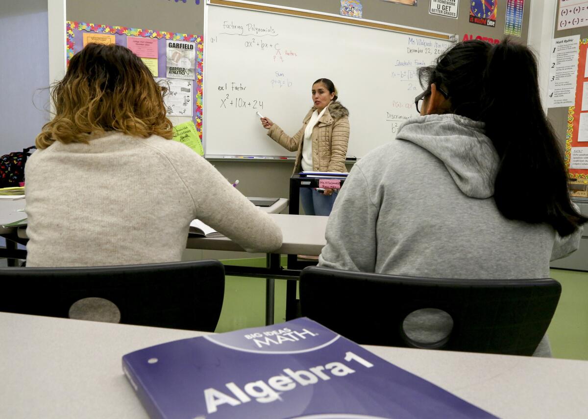 Math teacher Liliana Villalpando leads students through one of the credit-recovery courses at Garfield High School in December.