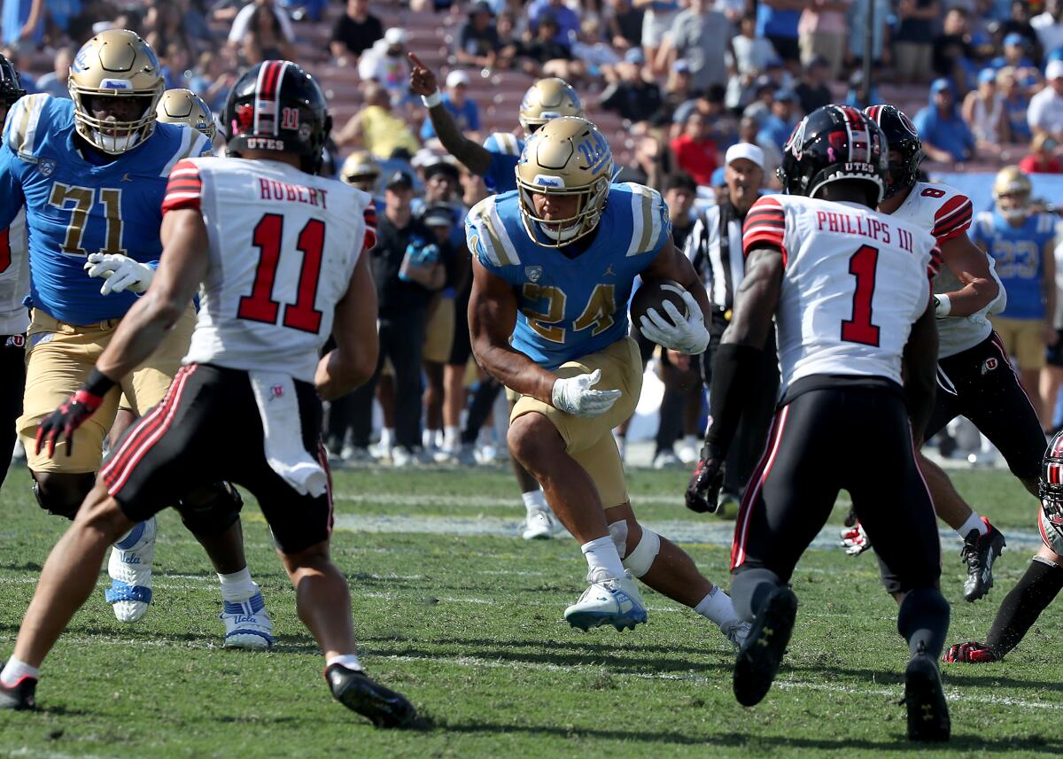 UCLA running back Zach Charbonnet carries the ball against Utah in the third quarter Oct. 8, 2022.