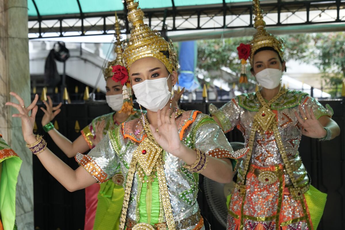 Thai classical dancers wearing masks