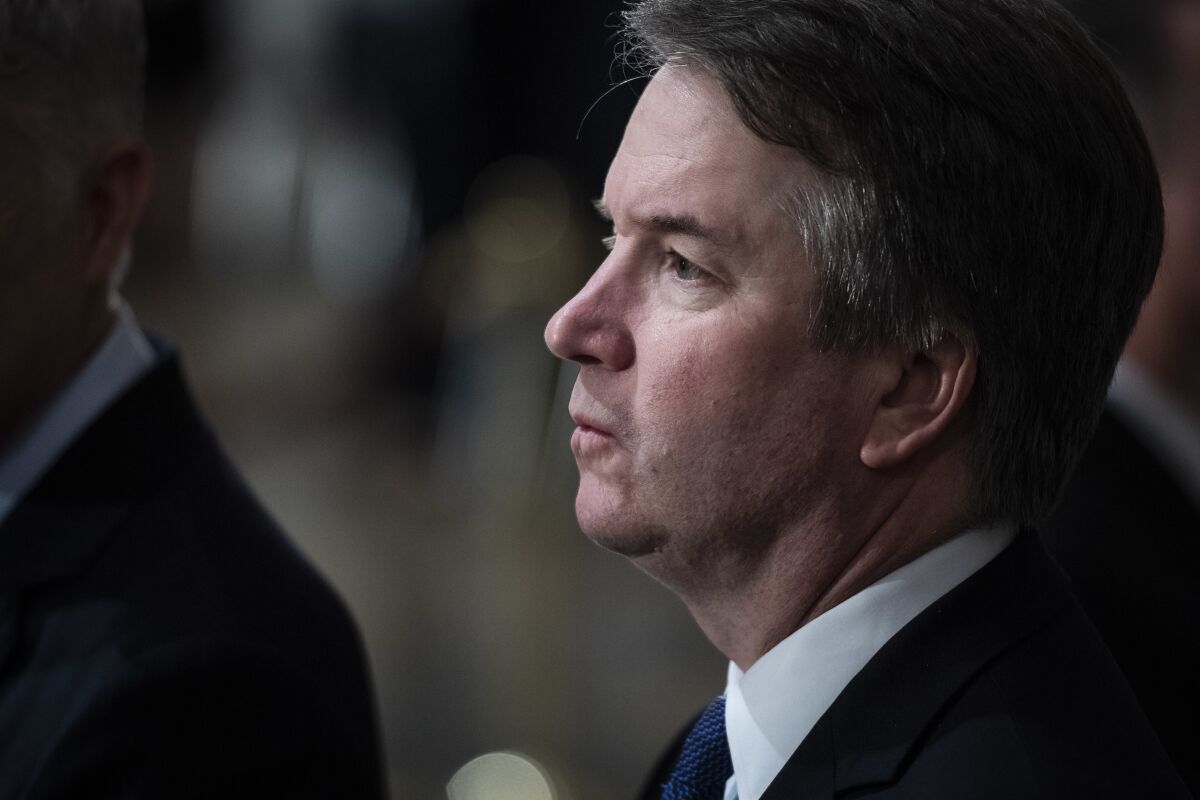A close-up of Supreme Court Justice Brett Kavanaugh, showing his face in profile 