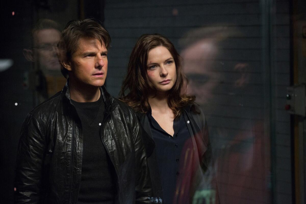 In this image released by Paramount Pictures, Tom Cruise and Rebecca Ferguson appear in a scene from "Mission: Impossible - Rogue Nation."