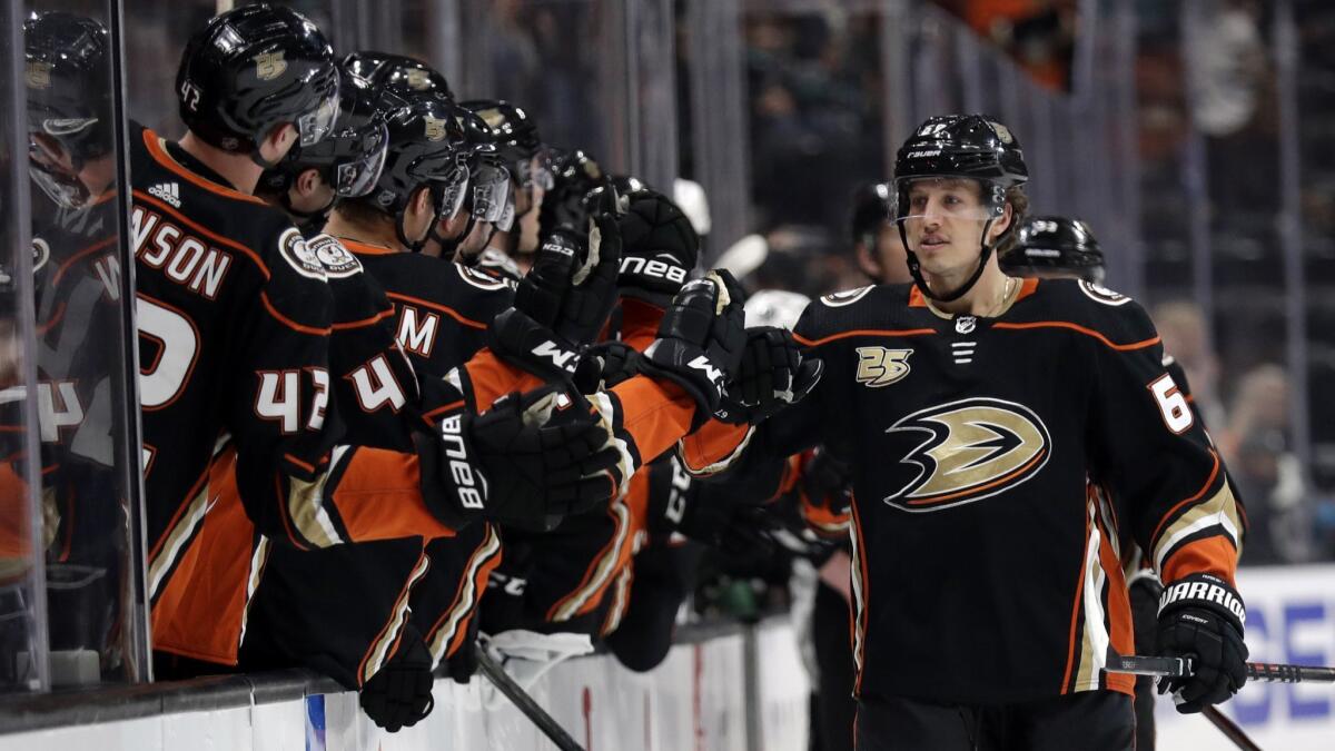 Ducks' Rickard Rakell, right, celebrates his goal with teammates during the first period on Friday.