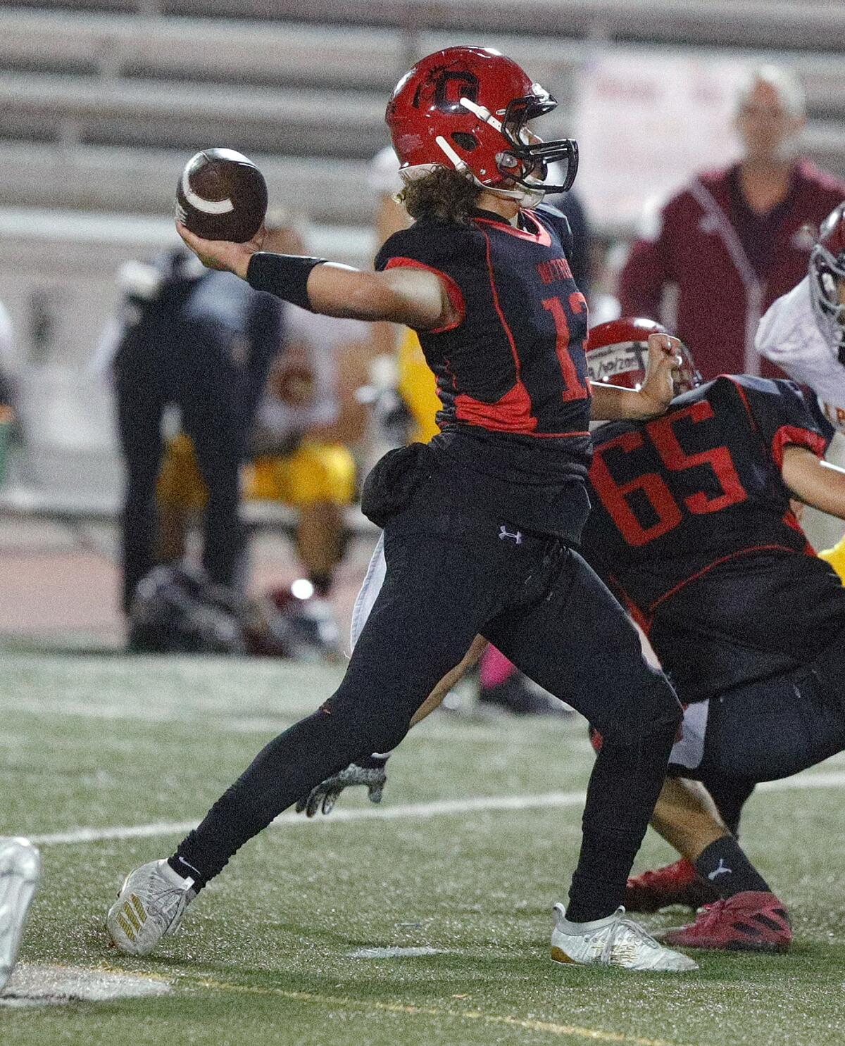 Glendale's quarterback Juan Estrada passes against Arcadia in a Pacific League football game at Glendale High School on Thursday, October 3, 2019.