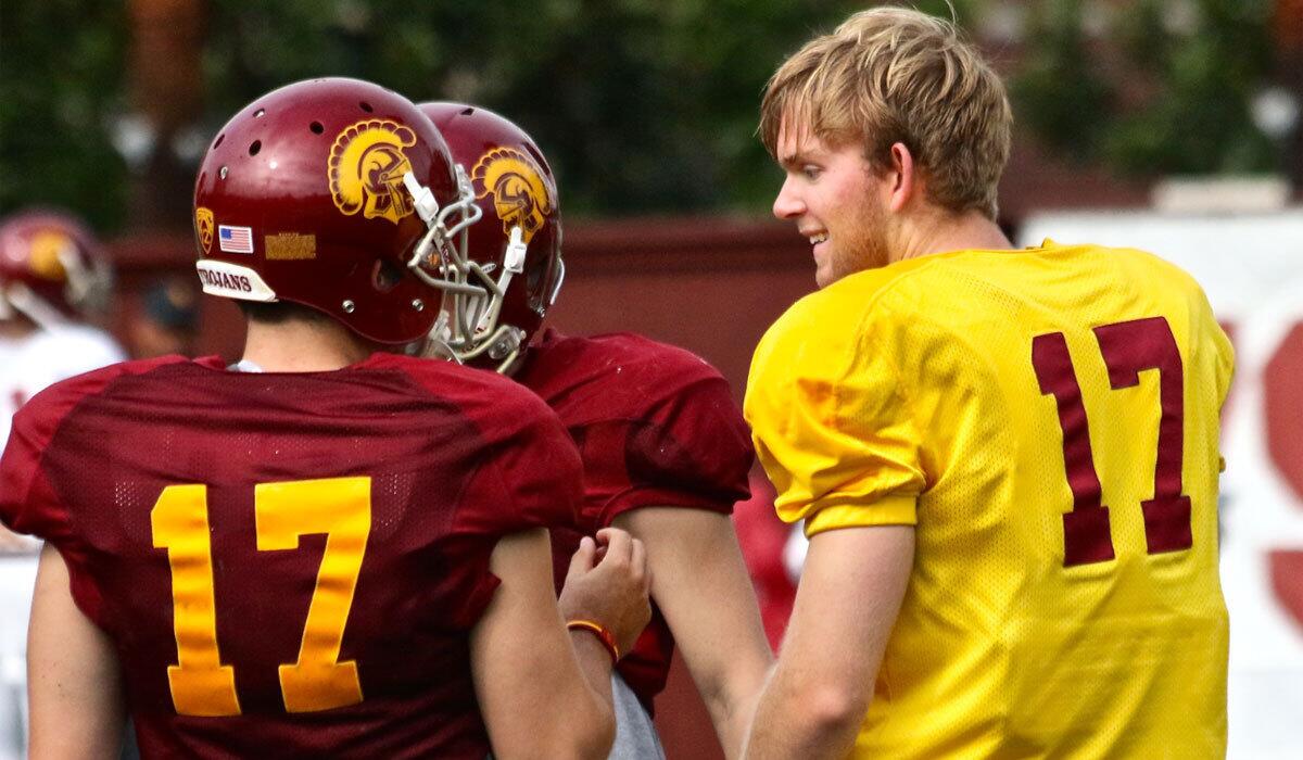 USC freshman Jake Olson, right, shares a laugh with teammate Kris Albarado during his first college practice.