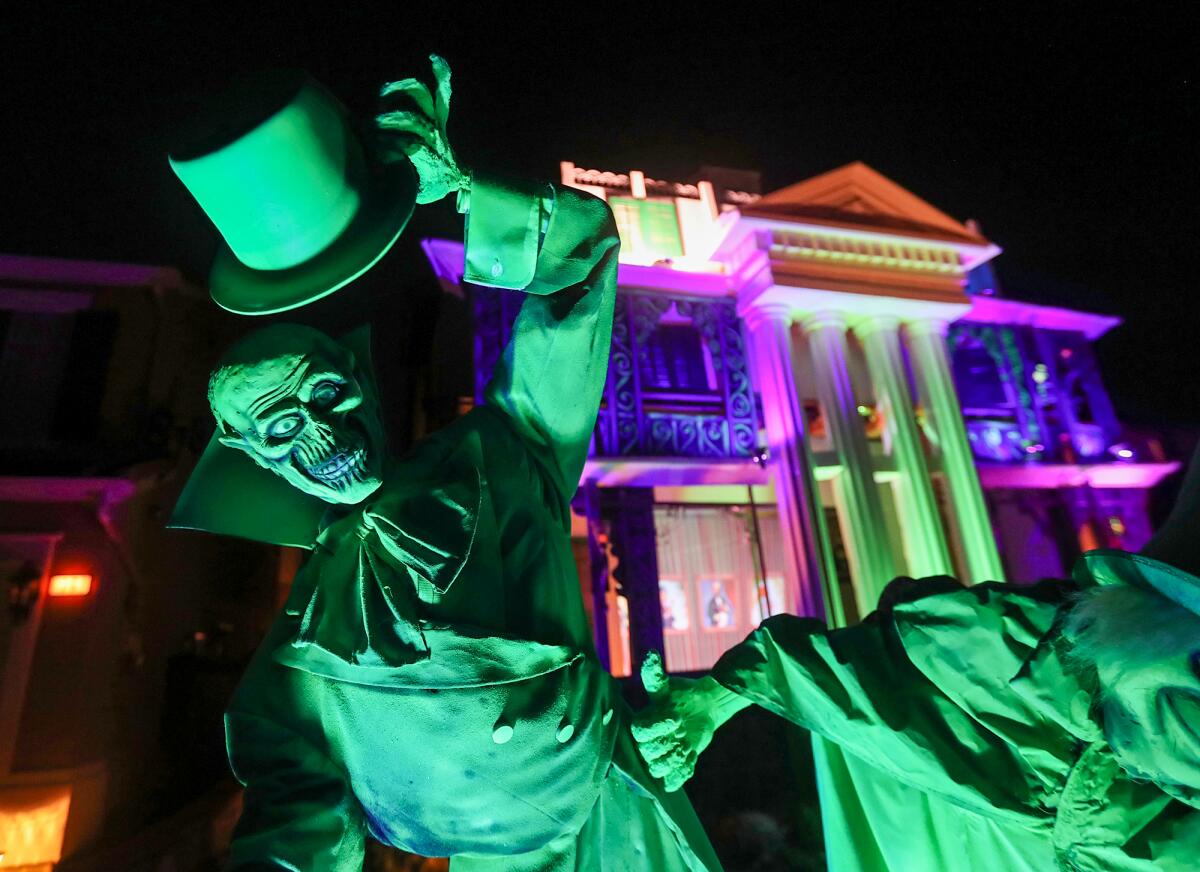 The hitchhiker ghosts are part of Mike and Dawn Stanley's Halloween Haunted Mansion in Aliso Viejo.