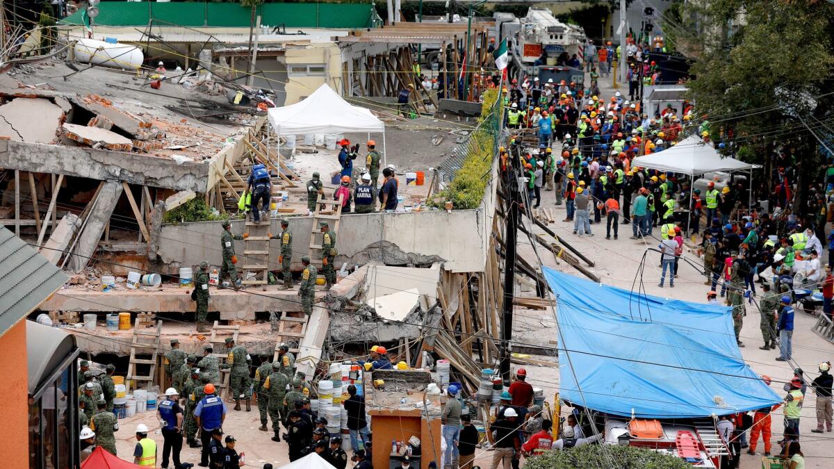 What was once a three-story building at the Enrique Rebsamen school collapsed. Structural engineers in California say this photo shows how concrete columns snapped -- an indication that not enough steel reinforcing bars were embedded in the concrete to stabilize the columns. (Gary Coronado / Los Angeles Times)