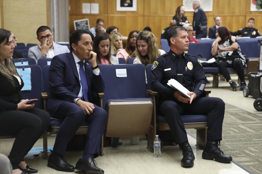 Mayor Todd Gloria and Assistant Police Chief Scott Wahl during a hearing for new SDPD Police Chief at the City Administration building in Downtown San Diego on Monday, April 29, 2024..(Photo by Sandy Huffaker for The SD Union-Tribune)