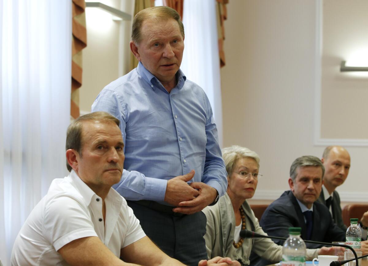 Former Ukrainian President Leonid Kuchma stands at a meeting with pro-Russia separatists in the eastern Ukraine city of Donetsk.