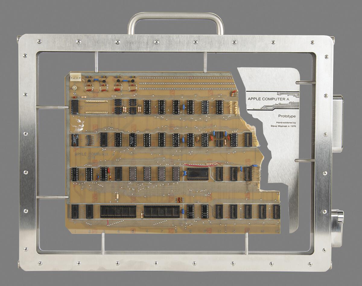 This image provided by Boston-based RR Auction, shows an authenticated Apple-1 Computer prototype from the mid-1970s that a Bay Area collector, who wishes to remain anonymous, made the winning $677,196 bid on Thursday, Aug. 18, 2022, the auctioneer said. The prototype was used by Apple co-founder Steve Jobs in 1976 to demonstrate the Apple-1 to Paul Terrell, owner of The Byte Shop in Mountain View, California, one of the first personal computer stores in the world, Boston-based RR Auction said in a statement. (RR Auction via AP)