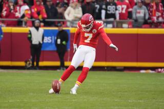 The Chiefs' Harrison Butker (7) kicks off the football. 