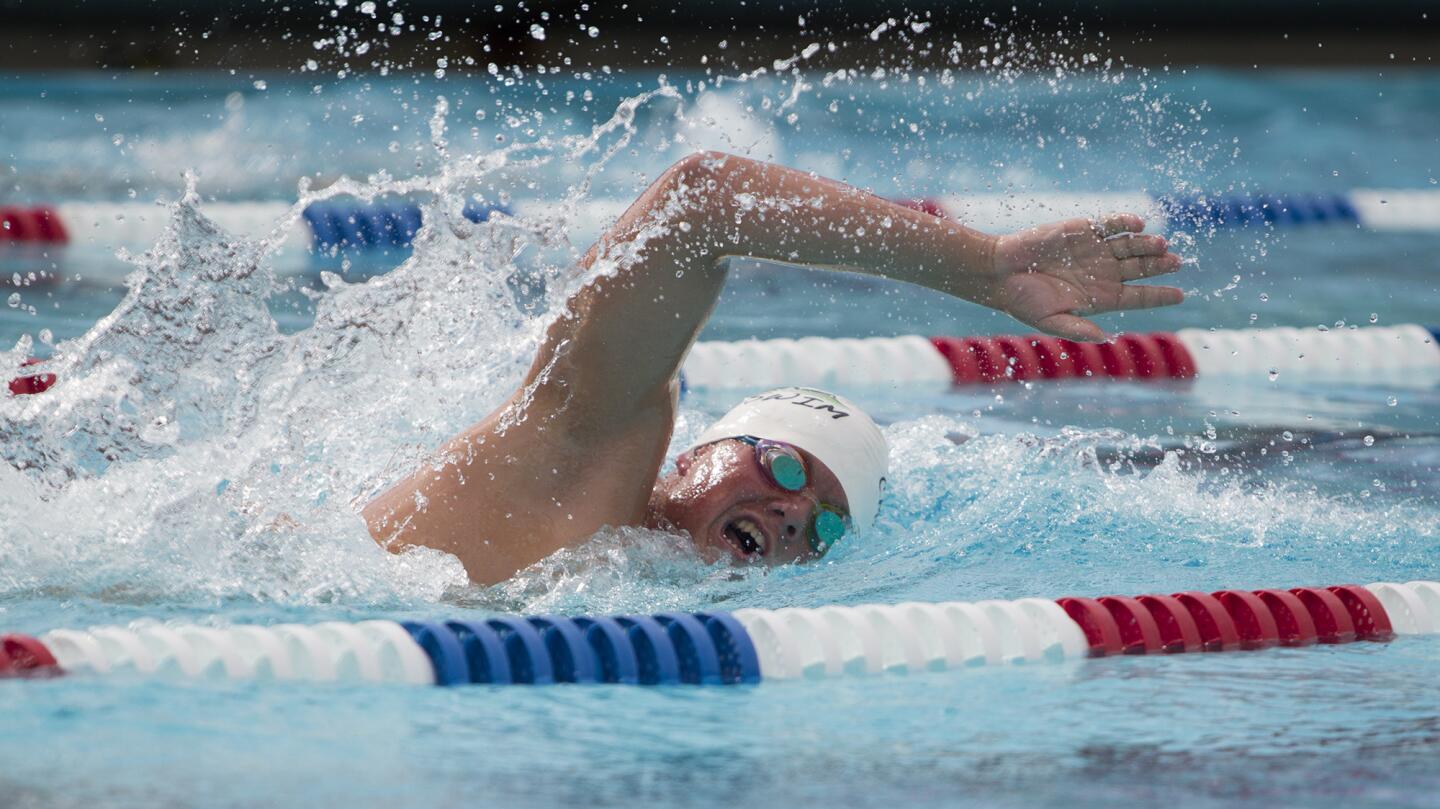 Costa Mesa High's Augie Cunningham wins the boys 500-meter freestyle race against Estancia during an Orange Coast League swim meet on Wednesday. (Kevin Chang/ Daily Pilot)