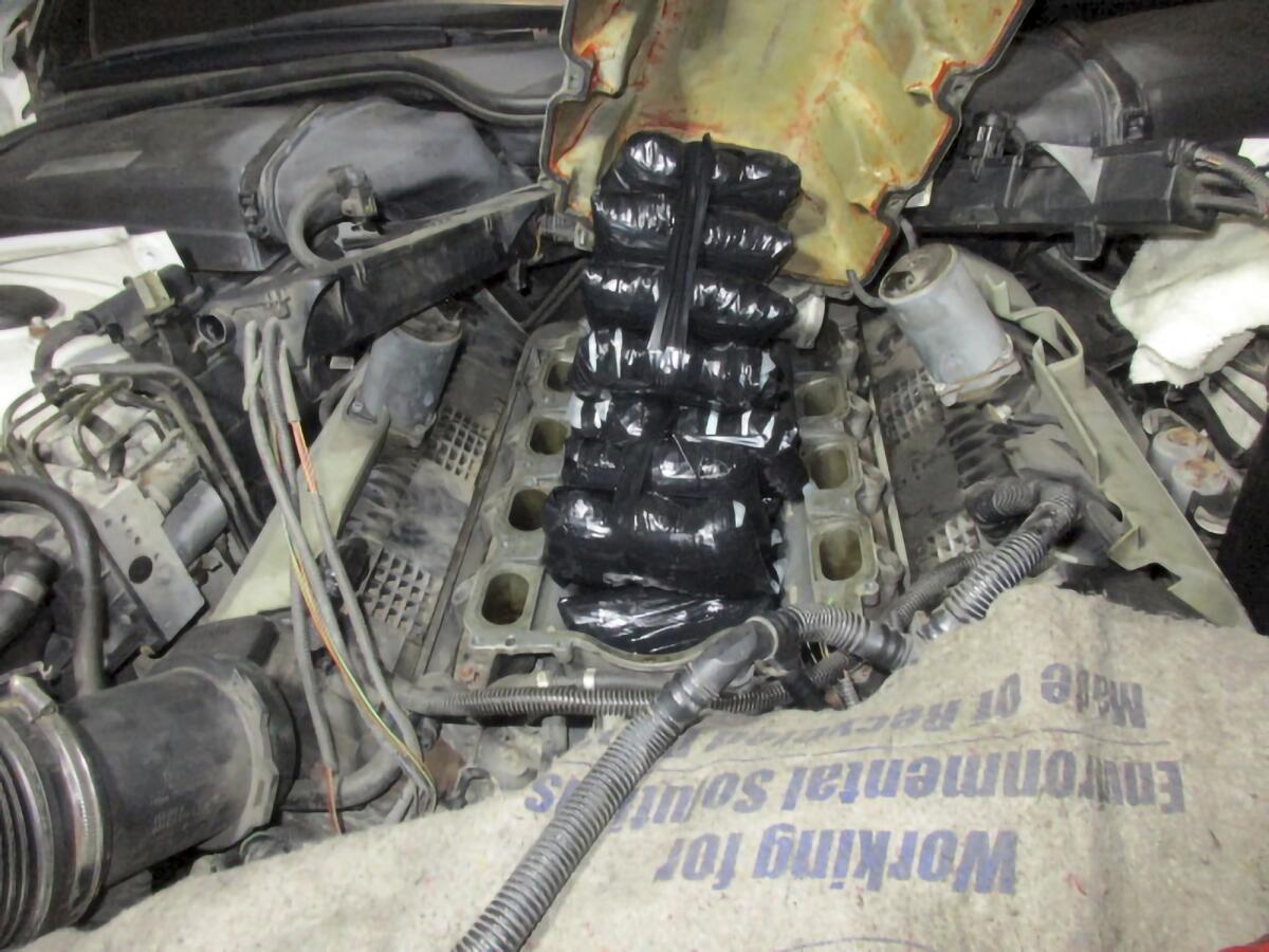 Drugs concealed inside the engine of a car. 