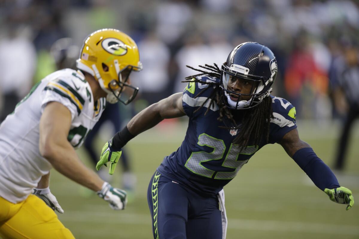NBC will pay more than $800 million this year for its "Sunday Night Football" pact. In this photo, Seattle Seahawks cornerback Richard Sherman (25) begins pass coverage against the Green Bay Packers.