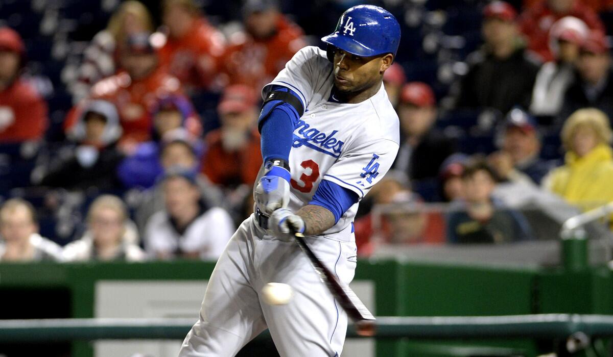 Dodgers left fielder Carl Crawford, who had three hits Monday night against the Nationals, connects for a single in the sixth inning.
