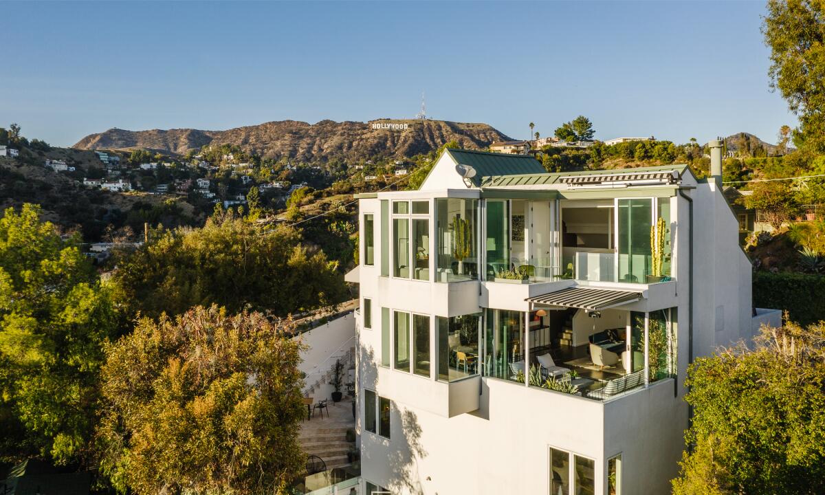 Diplo's four-story, 2,500-square-foot home takes advantage of the setting with walls of glass and multiple terraces.