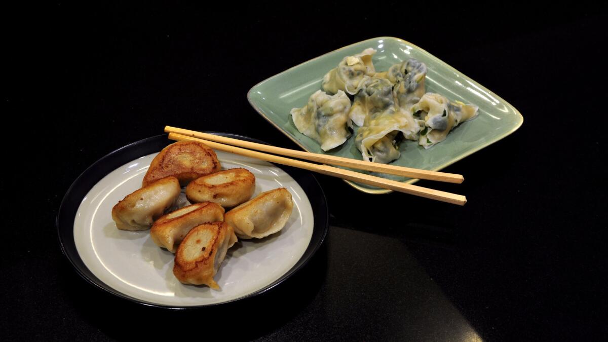 Pan-fried beef and pickled cabbage dumplings, left, and egg and vegetable wontons bought from a Los Angeles-area vendor who sells the food via WeChat.