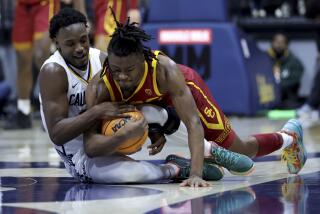 Southern California guard Isaiah Collier, right, and California guard Jalen Celestine vie for the ball during the second half of an NCAA college basketball game in Berkeley, Calif., Wednesday, Feb. 7, 2024. (AP Photo/Jed Jacobsohn)