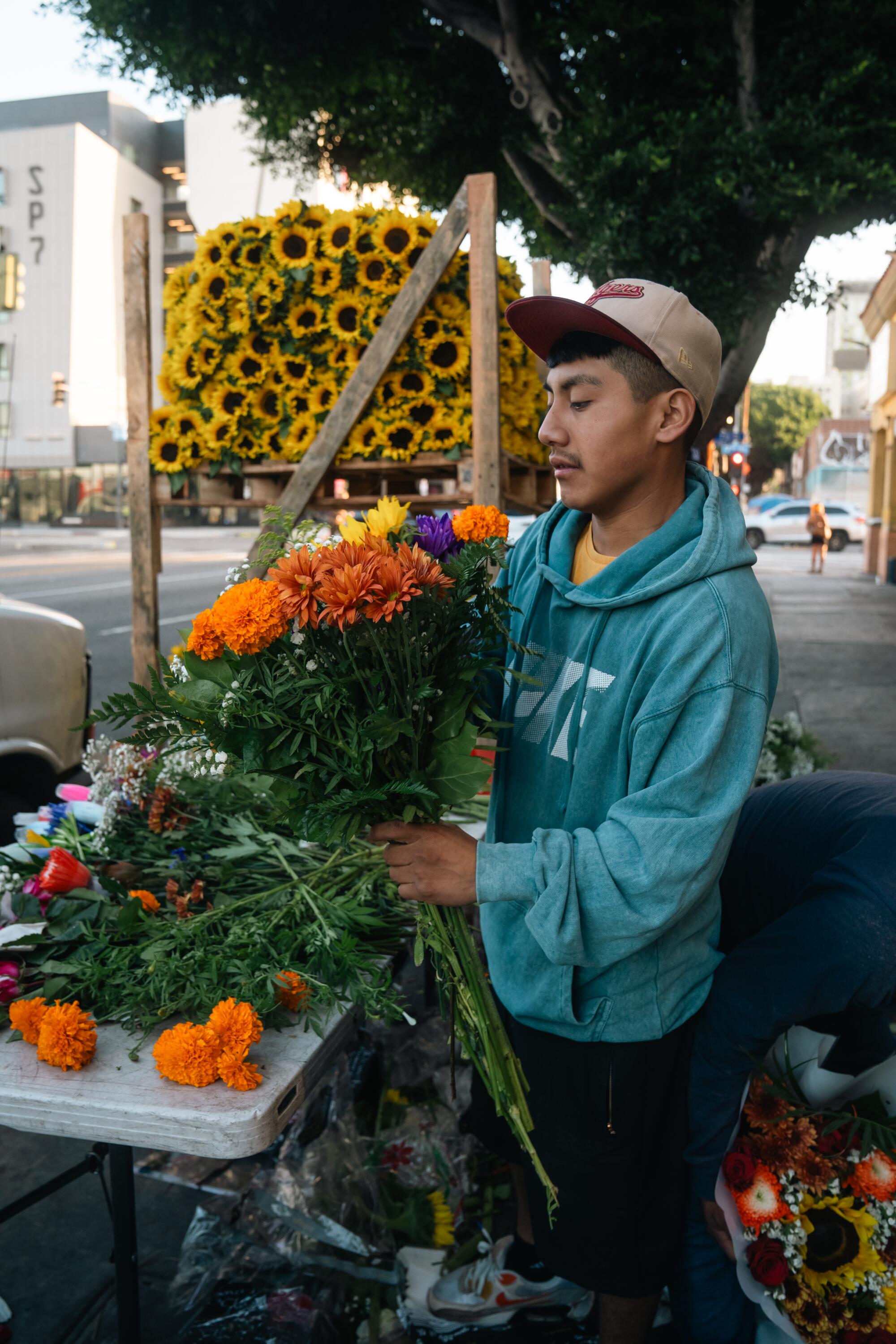 Worker Emmanuel Carrisoza prepares vibrant ready-to-go bouquets.