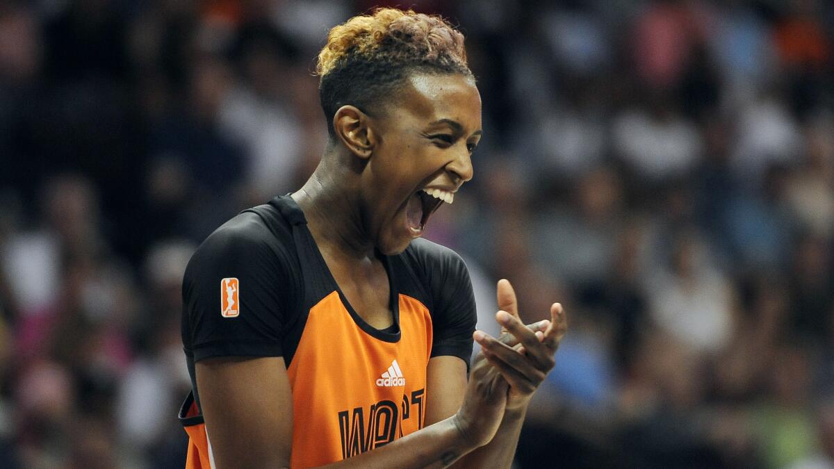 San Antonio Stars guard Danielle Robinson, playing for the West, celebrates during the first half of Saturday's WNBA All-Star Game in Uncasville, Conn.