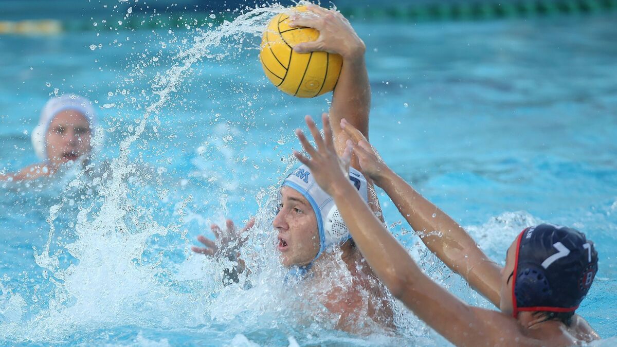 CdM boys' water polo senior Matt Ueberroth, shown taking a shot against Beckman on Oct. 30, scored three goals for the Sea Kings in Saturday's 10-6 win over Murrieta Valley in a CIF Southern Section Division 2 playoff quarterfinal match.