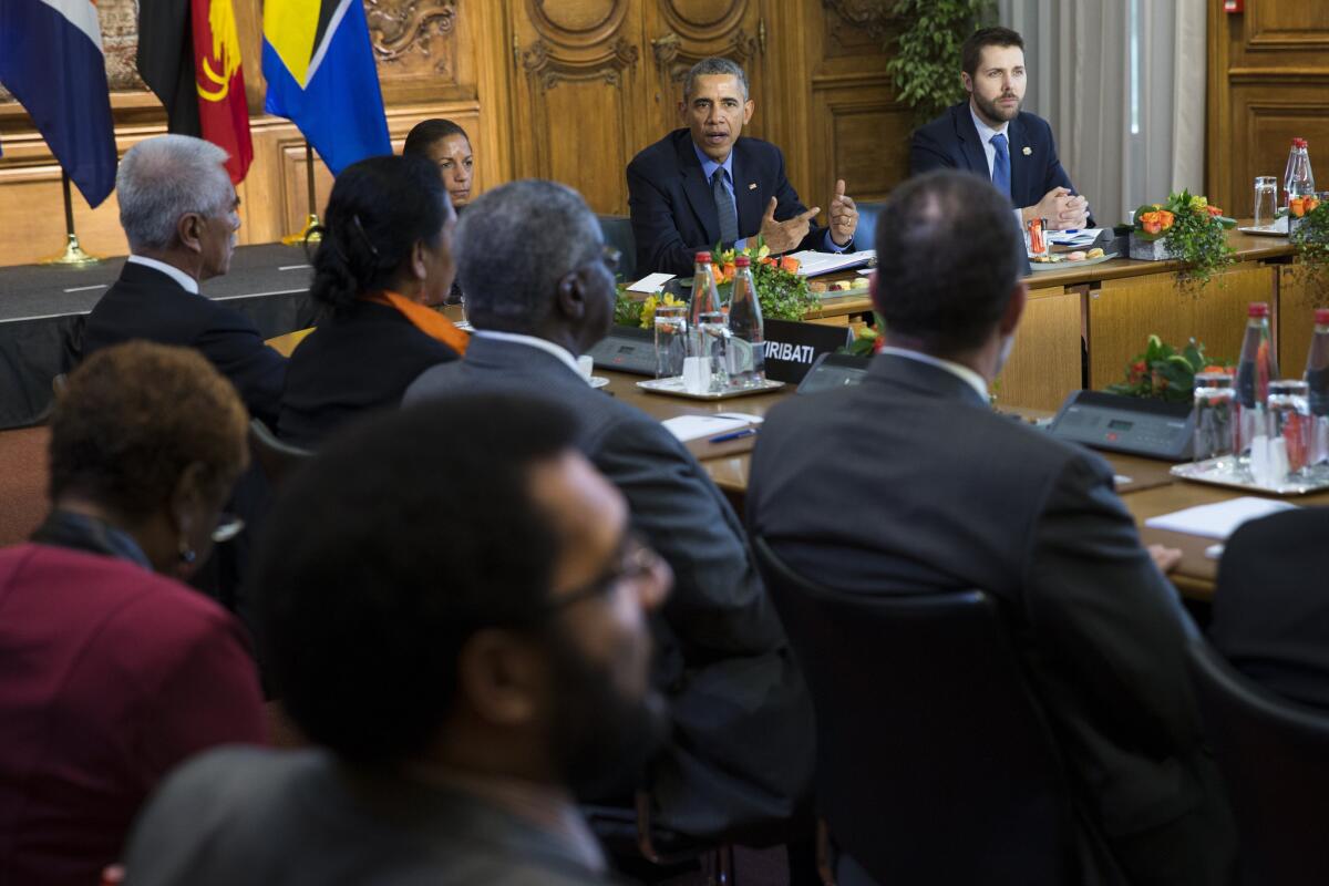 U.S. President Barack Obama speaks during a meeting with heads of state from small island nations most at risk from the harmful effects of climate change, in Paris, on Tuesday, Dec. 1, 2015. (AP Photo/Evan Vucci)