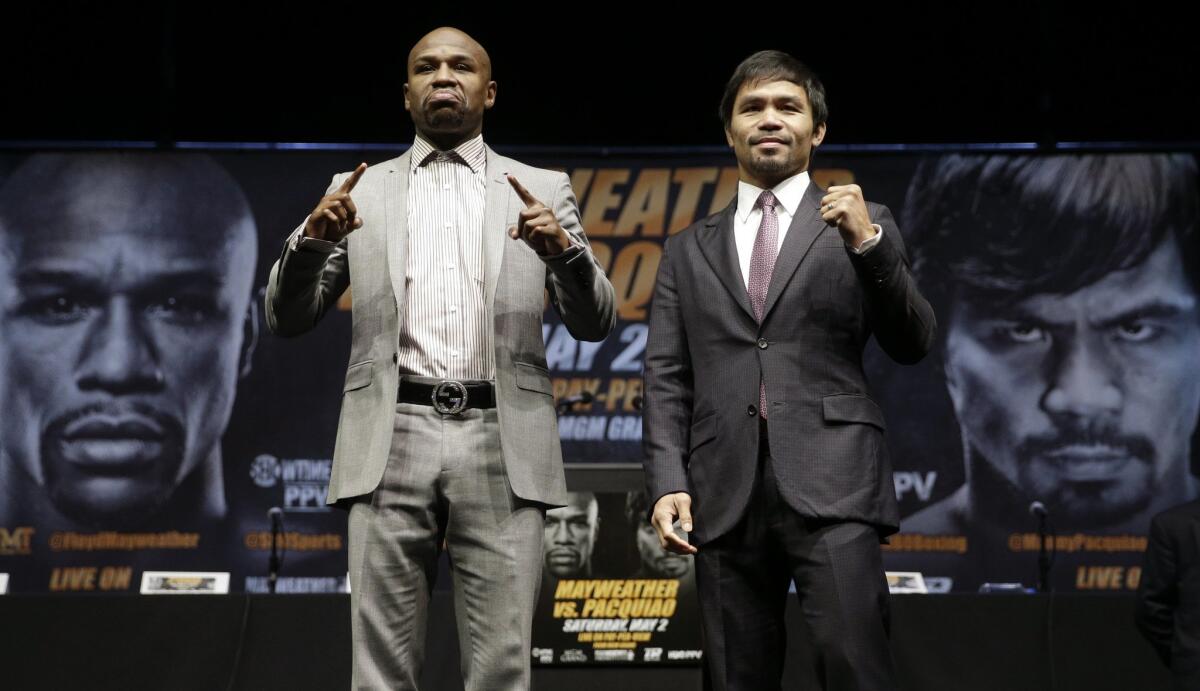 Floyd Mayweather Jr., left, and Manny Pacquiao at a news conference at Staples Center last month.