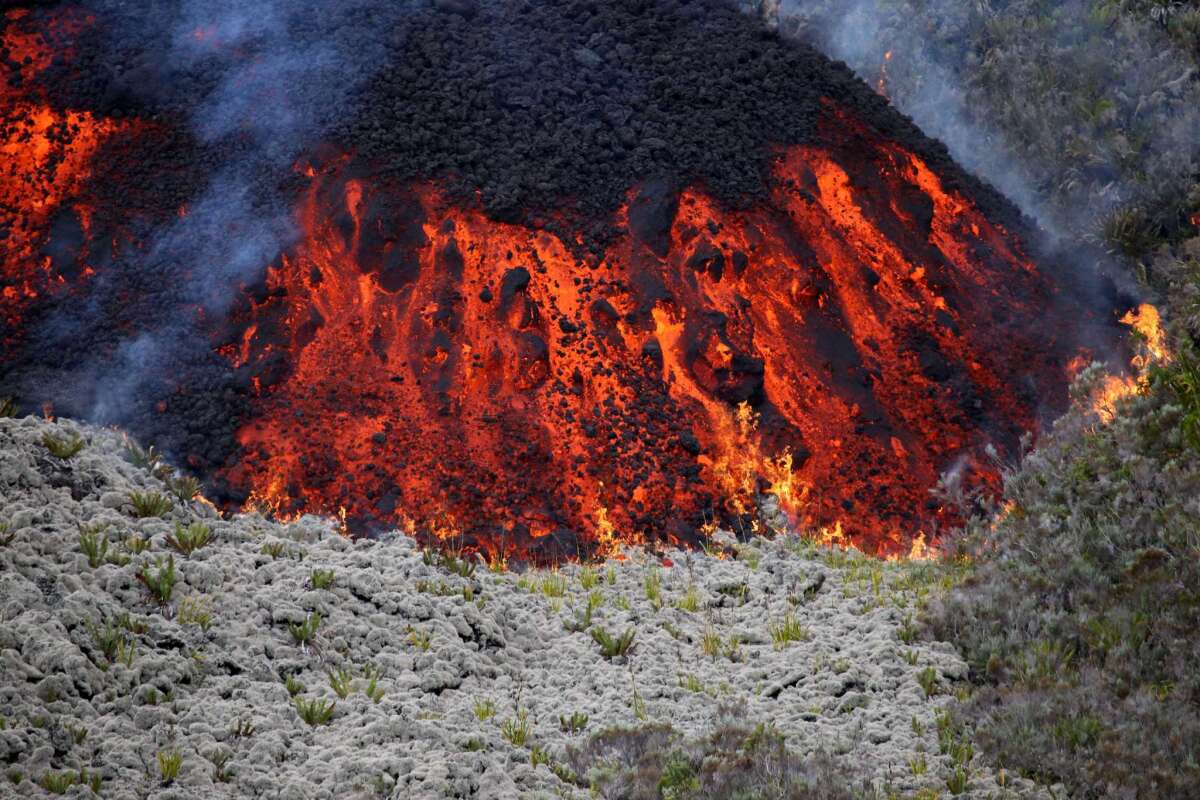 Lava flows out of the Piton de la Fournaise volcano as it erupts on Friday on Reunion Island in the Indian Ocean.