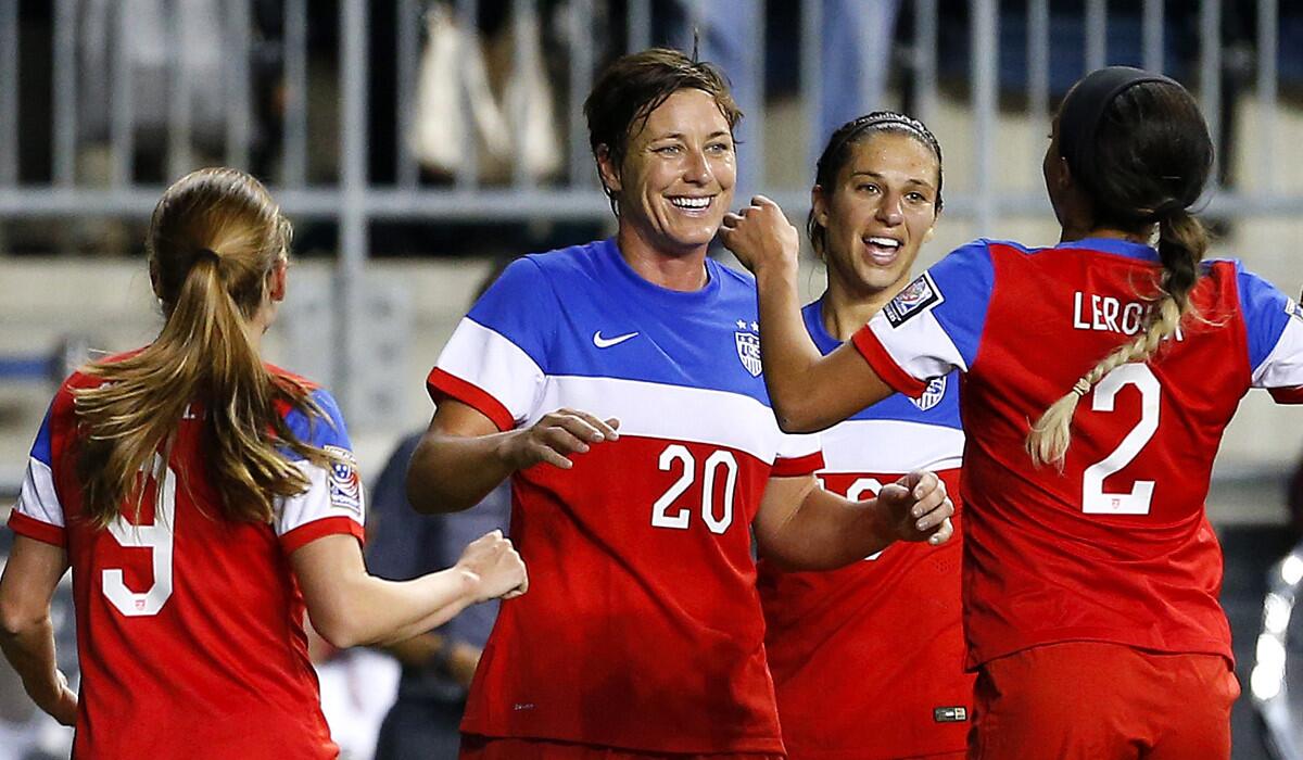 U.S. forward Abby Wambach (20) celebrates a goal against Costa Rica with teammates Heather O'Reilly (9), Carli Lloyd (10) and Sydney Leroux (2) in the second half Sunday.