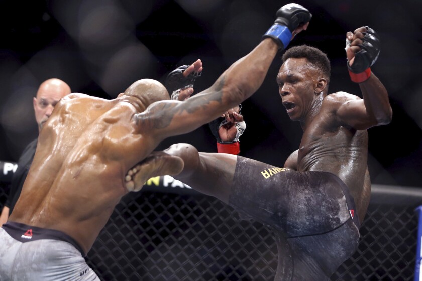 FILE - In this March 7, 2020, file photo, UFC middleweight champion Israel Adesanya of Nigeria.