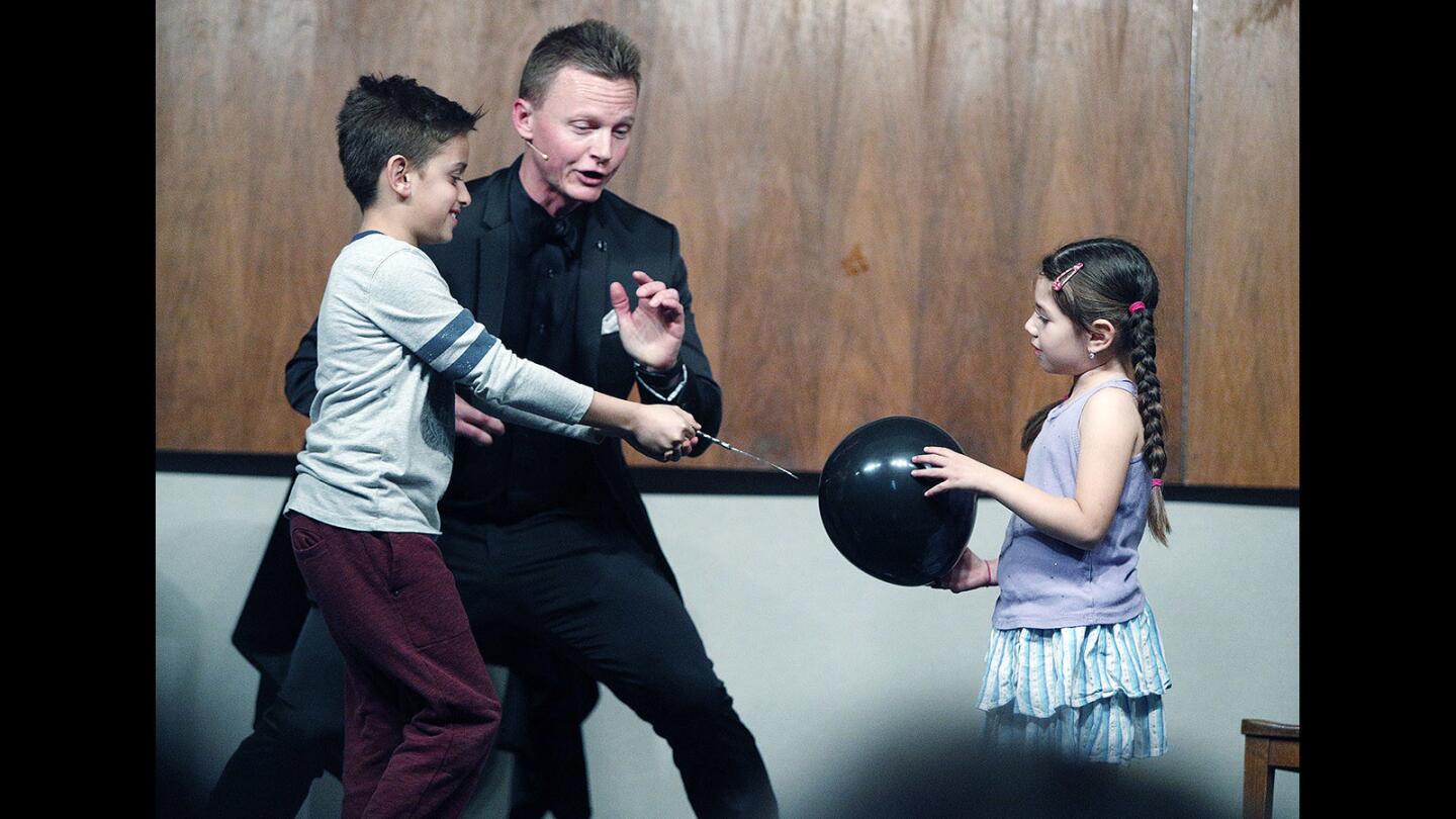 Photo Gallery: Comedian and magician Joel Ward performs for family night at Burbank Central Library