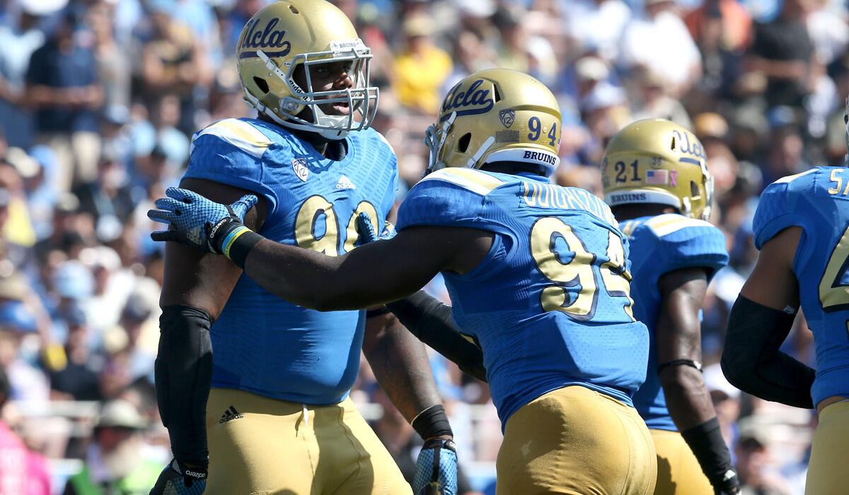 Defensive linemen Ellis McCarthy (90) and Owamagbe Odighizuwa (94) will be a focal point along with the defense in Saturday's game against California.