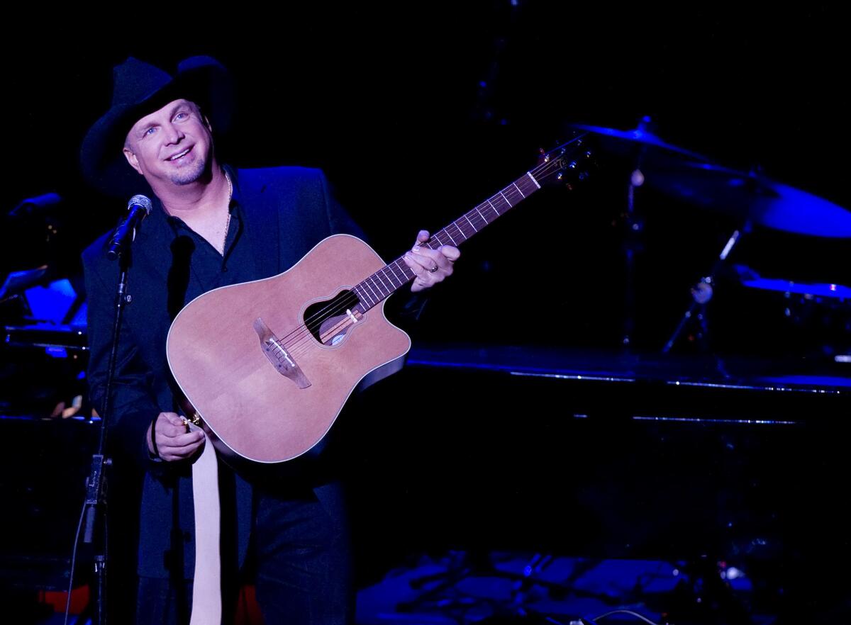 Garth Brooks, shown performing in New York in November, made "Today" show history on Jan. 8, becoming the first guest to appear during all four hours of the show.