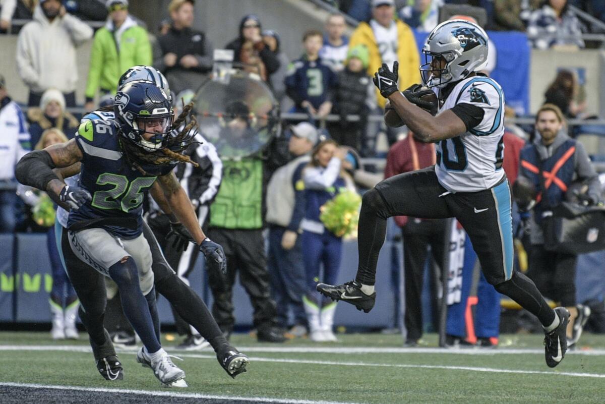 Panthers run over and through Seahawks for 30-24 victory - The San Diego  Union-Tribune