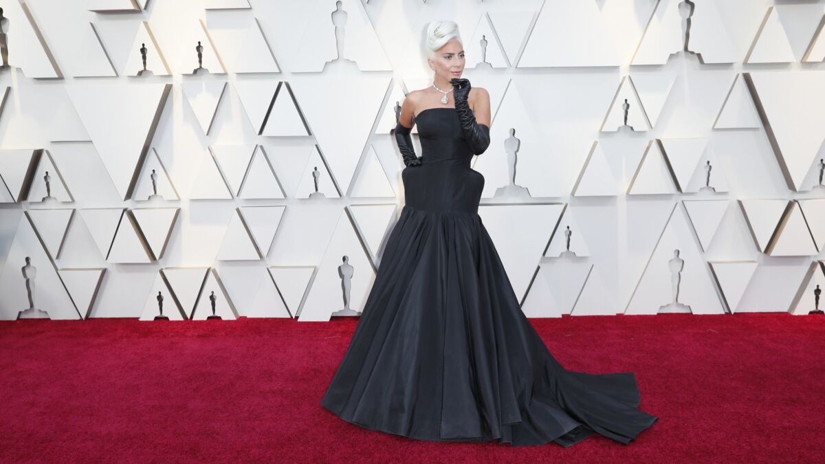 Lady Gaga shows off her dramatic gown and diamond necklace on the red carpet at the 91st Academy Awards on Sunday in Hollywood.