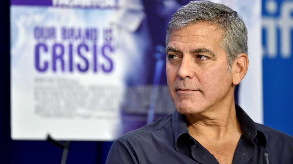 Actor George Clooney speaks onstage during the "Our Brand Is Crisis" press conference at the 2015 Toronto International Film Festival.