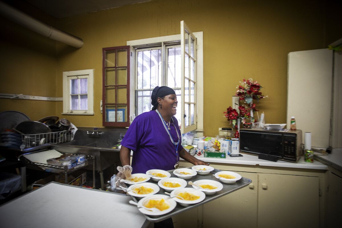 Big Mama volunteers in the kitchen at her church’s day camp in South Los Angeles on July 24.