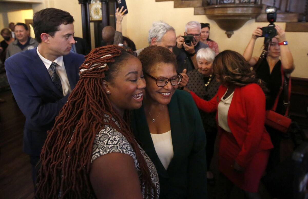 Los Angeles Mayor-elect Karen Bass poses for a selfie with a supporter