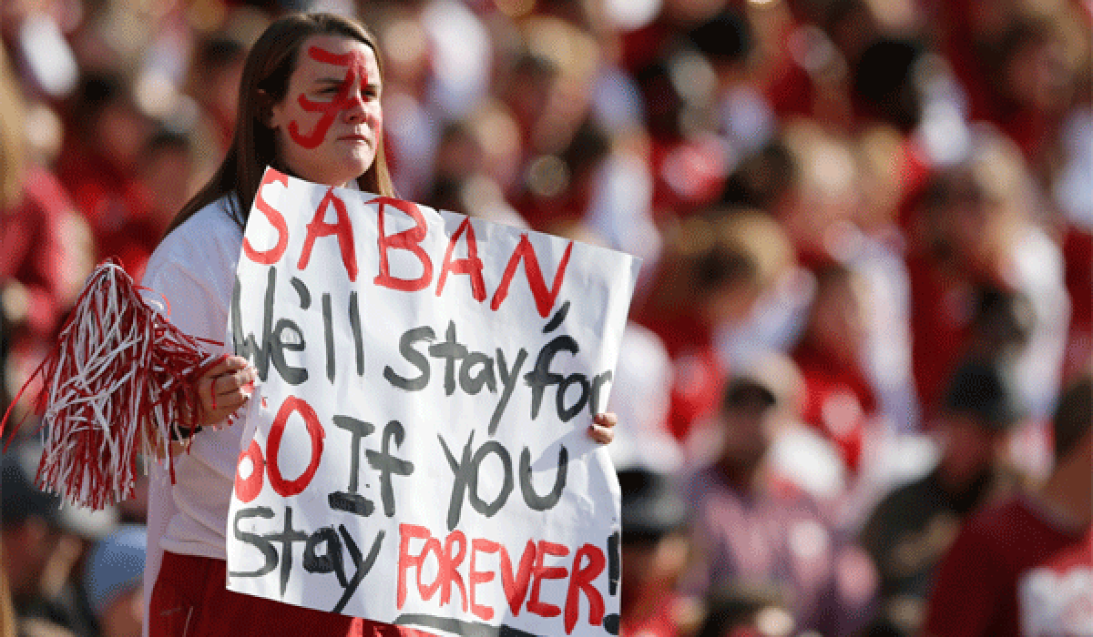 An Alabama fan holds up a sign for Coach Nick Saban, who had challenged students to stay for the entire game, during the Crimson Tide's victory over Tennessee at Bryant-Denny Stadium on Saturday.