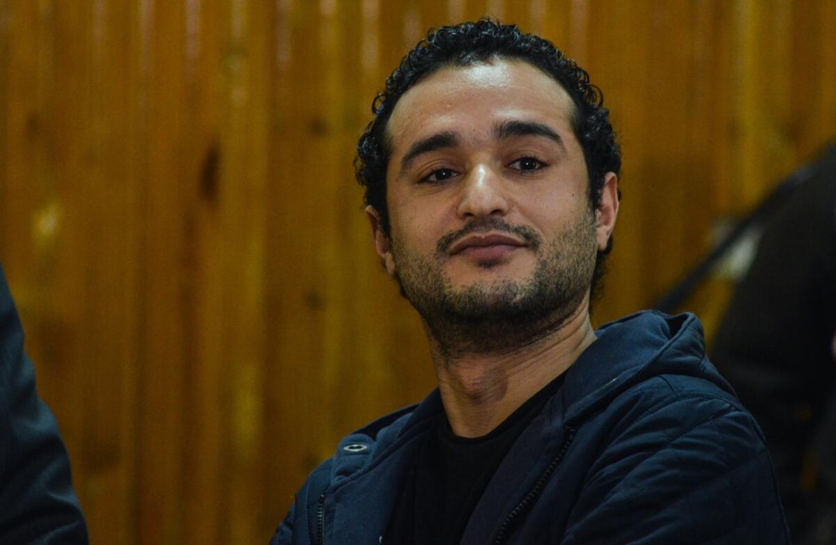 Egyptian opposition campaigner Ahmed Douma listens Feb. 4 as a court imposes a sentence of life in prison on him and 229 other people.