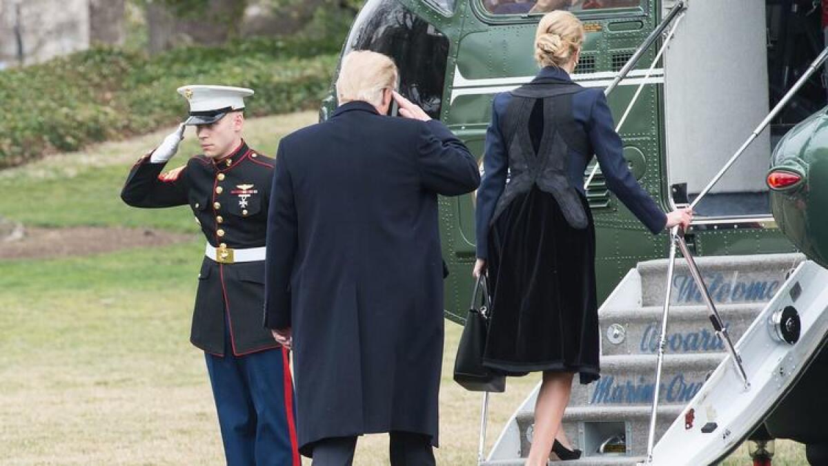 President Trump and his daughter Ivanka board Marine One on Wednesday on their way to Dover Air Force Base for the arrival of the remains of Chief Special Warfare Operator William "Ryan" Owens.