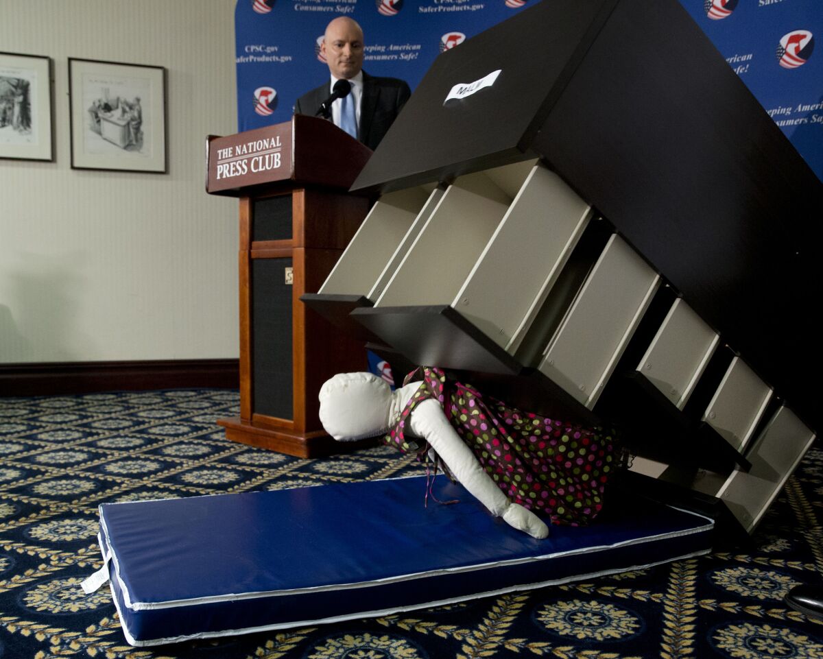 Consumer Product Safety Commission Chairman Elliot Kaye watches a demonstration of how an Ikea dresser can tip and fall on a child in Washington on Tuesday.