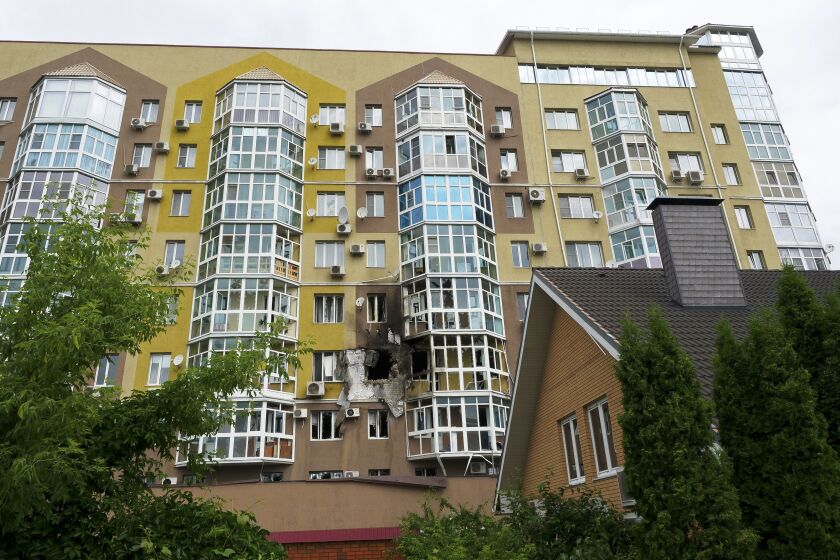 Broken windows and traces of fire are seen after a drone fell at a residential building in Voronezh, Russia, Friday, June 9, 2023. A Russian regional governor says three people were lightly wounded after a drone crashed into a residential building in central Voronezh, a city in southwestern Russia near the border with Ukraine. (Ara Kilanyants/Kommersant Publishing House via AP)