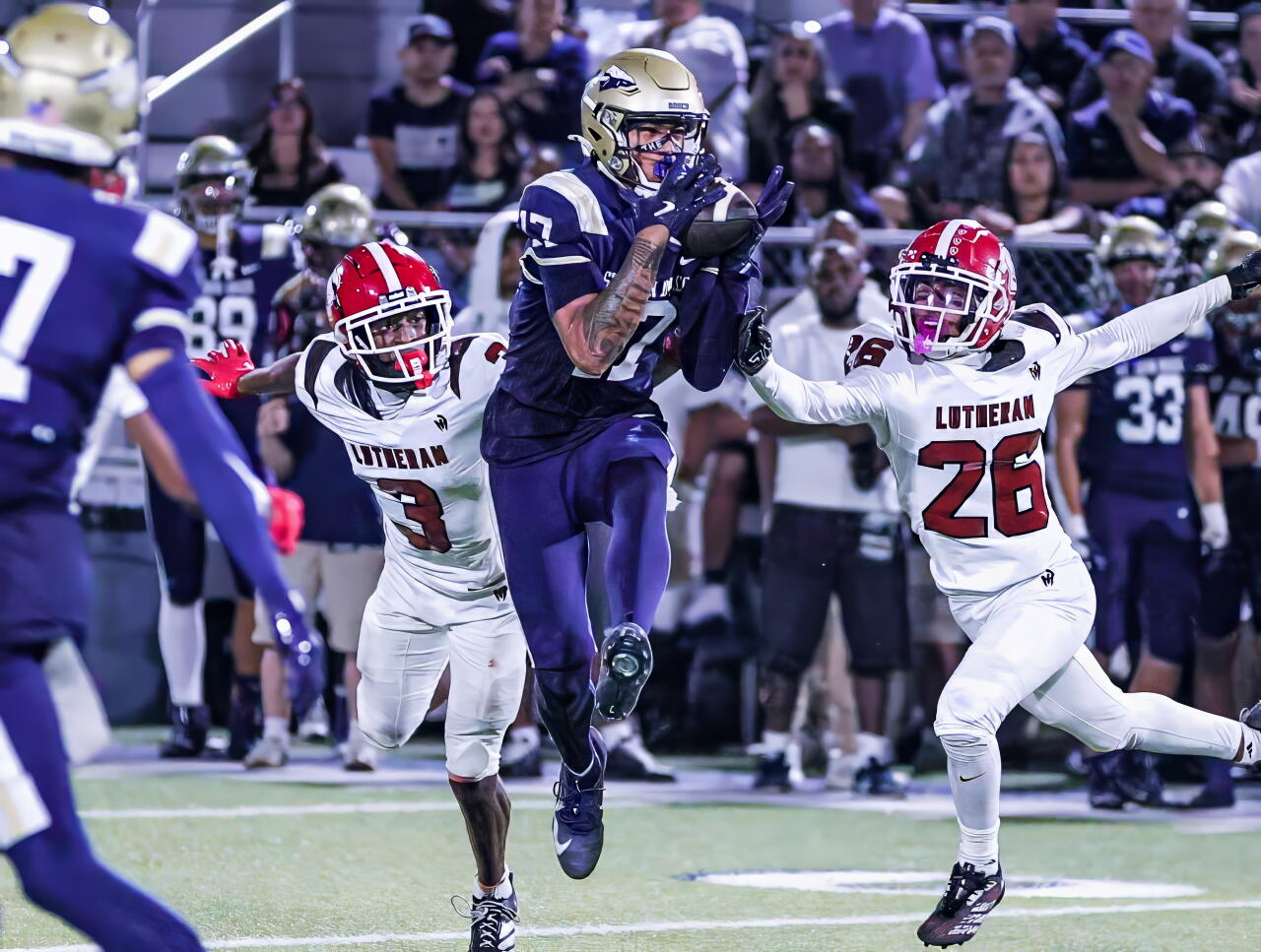 Kuika Moaalii, a 6-foot-5 sophomore, makes tough catch for St. John Bosco. He had four catches for 119 yards.